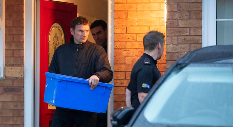 Police leave the home of Joanna and Thomas Maher with an evidence box at Wiltshire close in Warrington, Cheshire, Friday, Oct. 25, 2019. Police leave the home of Joanna and Thomas Maher with an evidence box at Wiltshire close in Warrington, Cheshire, Friday, Oct. 25, 2019.