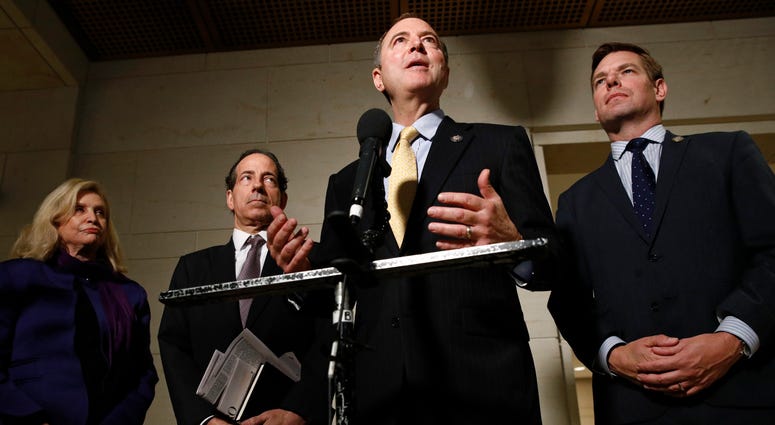 Rep. Adam Schiff, second from right, speaks with the media after former deputy national security adviser Charles Kupperman signaled that he wouldn't testify as part of the House impeachment inquiry into President Donald Trump, Oct. 28, 2019. House Democrats