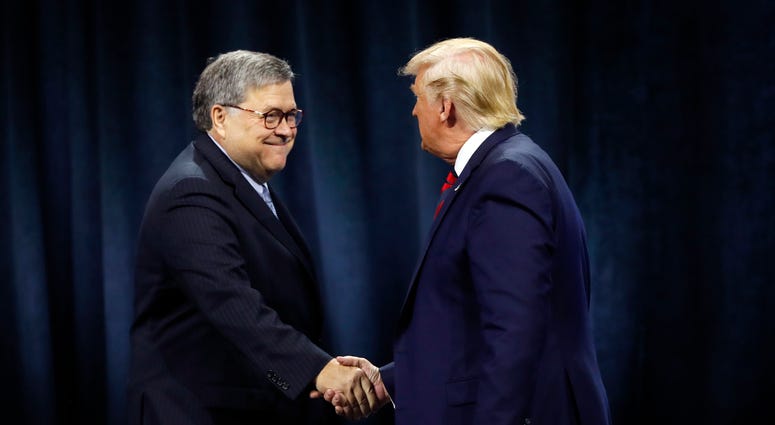 President Donald Trump shakes hands with Attorney General William Barr before Trump signed an executive order creating a commission to study law enforcement and justice at the International Association of Chiefs of Police Convention Oct. 28, 2019. President Donald Trump shakes hands with Attorney General William Barr before Trump signed an executive order creating a commission to study law enforcement and justice at the International Association of Chiefs of Police Convention Oct. 28, 2019.