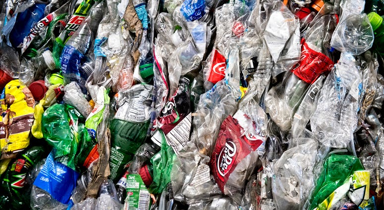 Crushed plastic bottles sit in a bale following sorting at the Mid-America Recycling plant, in Lincoln, Neb. Crushed plastic bottles sit in a bale following sorting at the Mid-America Recycling plant, in Lincoln, Neb.