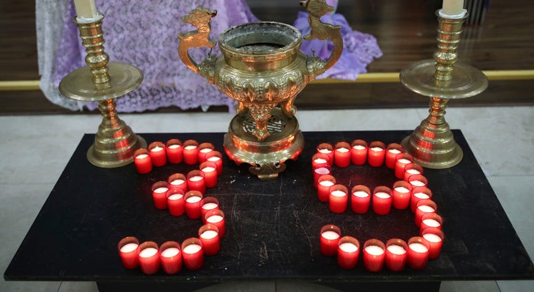 Candles are laid out as Father Simon Thang Duc Nguyen speaks at The Holy Name and Our Lady of the Sacred Heart Church, London's Vietnamese church, in east London. Candles are laid out as Father Simon Thang Duc Nguyen speaks at The Holy Name and Our Lady of the Sacred Heart Church, London's Vietnamese church, in east London.