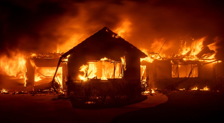 Flames from the Hillside Fire consume a home in San Bernardino, Ca. Flames from the Hillside Fire consume a home in San Bernardino, Ca.