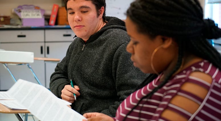 Joseph Tucker watches as Makizah Cotton makes an argument in civics class at Chatham Central High School in Bear Creek, N.C., on Tuesday, Nov. 5, 2019. Joseph Tucker watches as Makizah Cotton makes an argument in civics class at Chatham Central High School in Bear Creek, N.C., on Tuesday, Nov. 5, 2019.