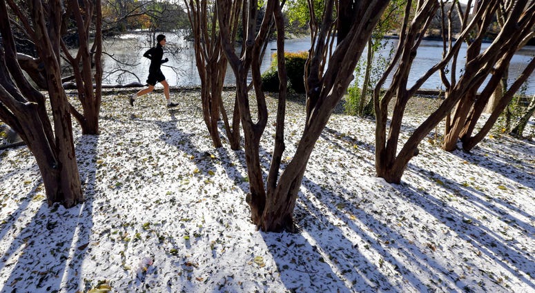 A jogger braves temperatures in the teens as he goes for a run Tuesday, Nov. 12, 2019, in Nashville, Tenn. Snow and icy conditions are snarling traffic and closing or delaying schools in parts of the Northeast and South. A jogger braves temperatures in the teens as he goes for a run Tuesday, Nov. 12, 2019, in Nashville, Tenn. Snow and icy conditions are snarling traffic and closing or delaying schools in parts of the Northeast and South.