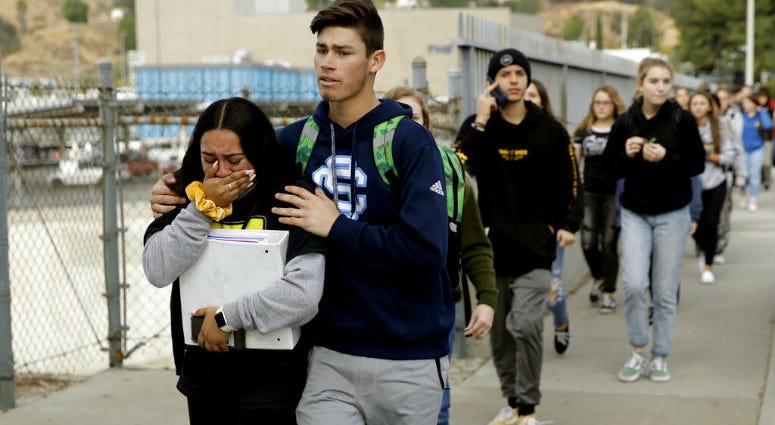 Students are escorted out of Saugus High School after reports of a shooting on Thursday, Nov. 14, 2019, in Santa Clarita, Calif. Students are escorted out of Saugus High School after reports of a shooting on Thursday, Nov. 14, 2019, in Santa Clarita, Calif.