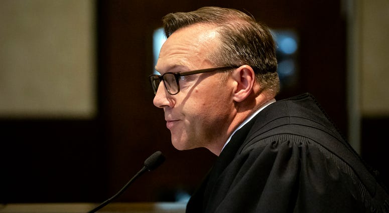 In this Aug. 26, 2019 file photo, Judge Thad Balkman reads a summary of his decision in the opioid trial at the Cleveland County Courthouse in Norman, Okla. In this Aug. 26, 2019 file photo, Judge Thad Balkman reads a summary of his decision in the opioid trial at the Cleveland County Courthouse in Norman, Okla.