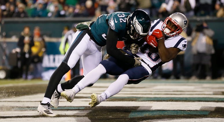 New England Patriots' Phillip Dorsett (13) hangs onto a touchdown pass against Philadelphia Eagles' Rasul Douglas (32) during the second half of an NFL football game against the Philadelphia Eagles, Sunday, Nov. 17, 2019, in Philadelphia. New England Patriots' Phillip Dorsett (13) hangs onto a touchdown pass against Philadelphia Eagles' Rasul Douglas (32) during the second half of an NFL football game against the Philadelphia Eagles, Sunday, Nov. 17, 2019, in Philadelphia.