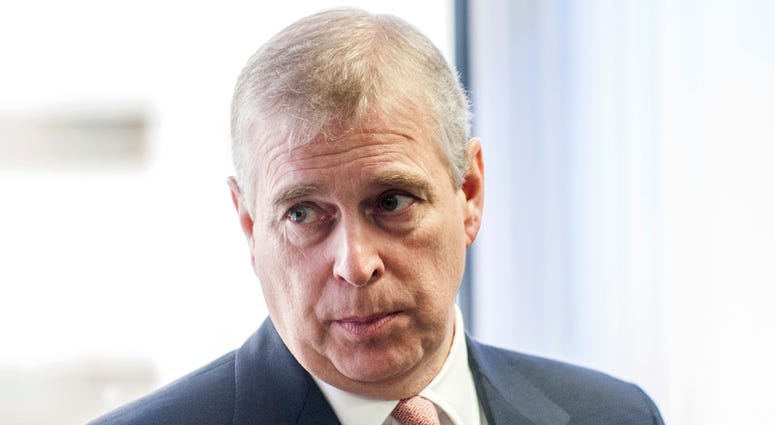 In this Monday, April 13, 2015 file photo, Britain's Prince Andrew visits the AkzoNobel Decorative Paints facility in Slough, England. Prince Andrew