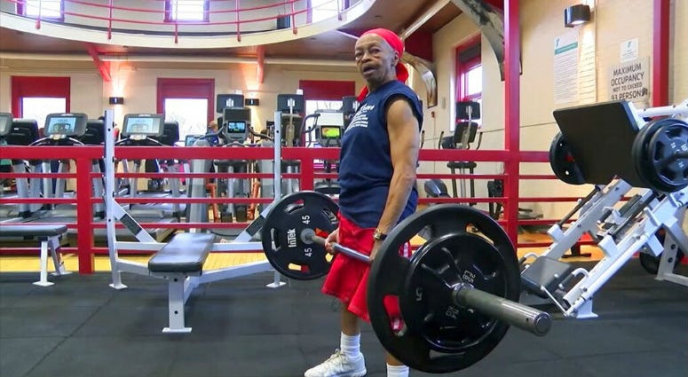 This photo, provided by 13 WHAM-TV on Monday Nov. 25, 2019, shows Willie Murphy, 82, as she lifts weights at a gym in Rochester, N.Y. This photo shows Willie Murphy, 82, as she lifts weights at a gym in Rochester, N.Y.