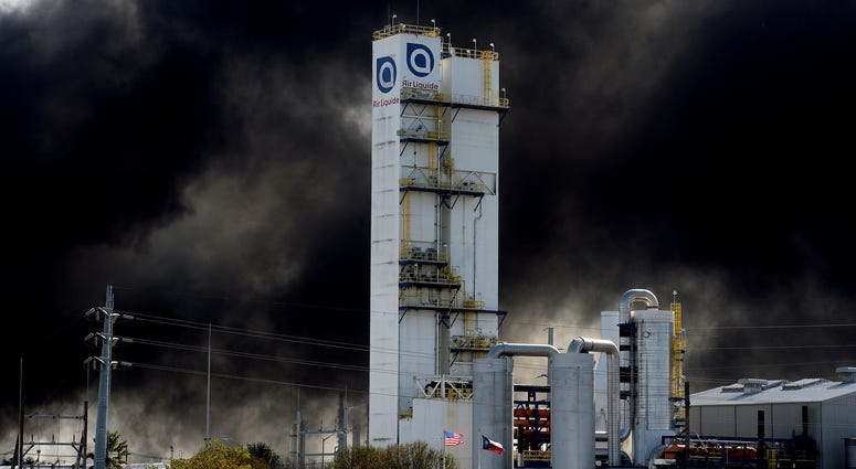 Thick smoke fills the sky above the TPC plant Wednesday, Nov. 27, 2019, in Port Neches, Texas. TPC plant explosion