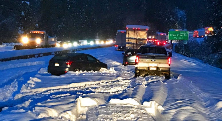 In this photo taken Tuesday, Nov. 26, 2019, provided by Caltrans, are cars and trucks in stopped traffic on Interstate 5 near Dunsmuir, Calif. Cars and trucks in stopped traffic on Interstate 5 near Dunsmuir, Calif.