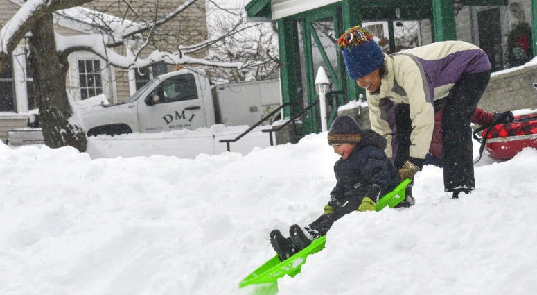 Edisa Weeks gives her 5-year-old nephew, Niko Brown, a push down a hill at the Brattleboro Little League Field, in Brattleboro, Vt.. Edisa Weeks gives her 5-year-old nephew, Niko Brown, a push down a hill at the Brattleboro Little League Field, in Brattleboro, Vt..