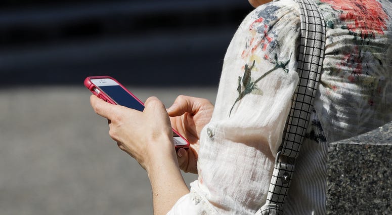 A woman browses her smartphone in Philadelphia in April 8, 2019. A woman browses her smartphone in Philadelphia in April 8, 2019.