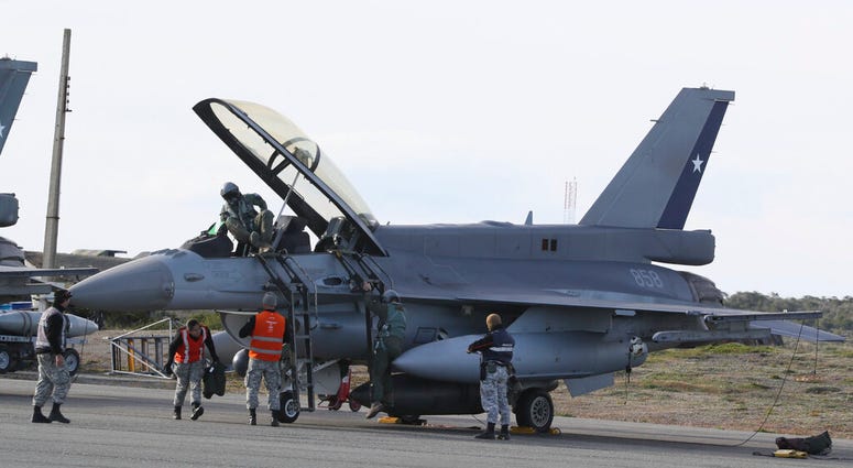 The crew of a Chile's Air Force fighter jet arrives from a search mission of a missing C-130 Hercules in Punta Arenas, Chile. The crew of a Chile's Air Force fighter jet arrives from a search mission of a missing C-130 Hercules in Punta Arenas, Chile.
