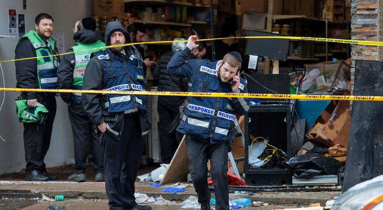 Responders work to clean up the scene of Tuesday's shooting that left multiple people dead at a kosher market on Wednesday Dec. 11, 2019, in Jersey City, N.J. Aftermath of Jersey City shooting