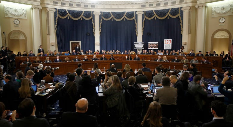 Member of the committee work during a House Judiciary Committee markup of the articles of impeachment against President Donald Trump, Friday, Dec. 13, 2019, on Capitol Hill in Washington. House Judiciary Committee
