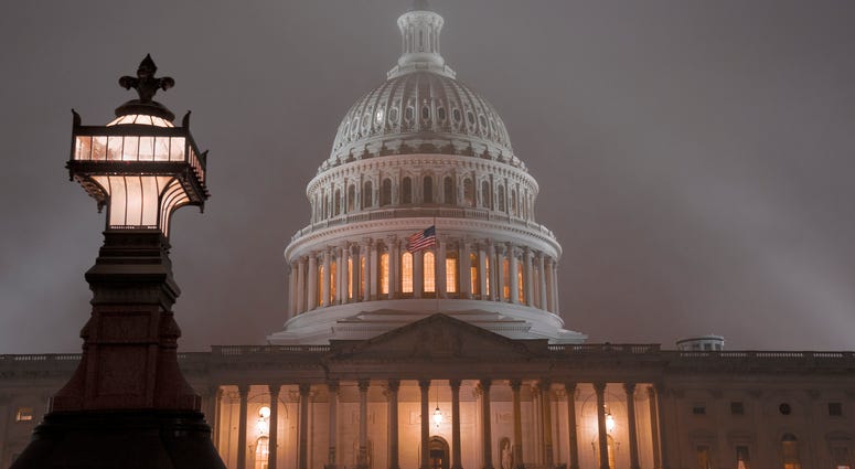 The U.S. Capitol in Washington is shrouded in mist, Friday night, Dec. 13, 2019. The U.S. Capitol in Washington is shrouded in mist, Friday night, Dec. 13, 2019.