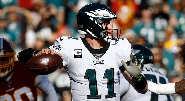 Philadelphia Eagles quarterback Carson Wentz (11) passes the ball against the Washington Redskins in the first half of an NFL football game, Sunday, Dec. 15, 2019, in Landover, Md. Philadelphia Eagles quarterback Carson Wentz (11) passes the ball against the Washington Redskins in the first half of an NFL football game, Sunday, Dec. 15, 2019, in Landover, Md.