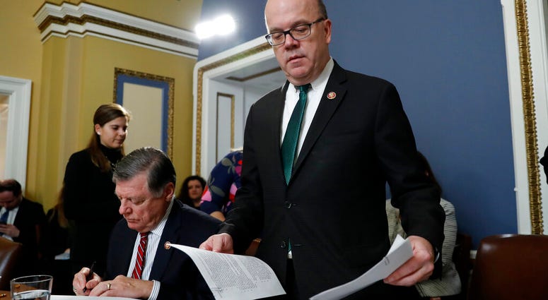 House Rules Committee chairman Rep. Jim McGovern, D-Mass., right, arrives for a House Rules Committee hearing on the impeachment against President Donald Trump. House Rules Committee chairman Rep. Jim McGovern, D-Mass., right, arrives for a House Rules Committee hearing on the impeachment against President Donald Trump
