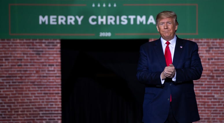 President Donald Trump arrives at W.K. Kellogg Airport to attend a campaign rally, Wednesday, Dec. 18, 2019, in Battle Creek, Mich. Donald Trump