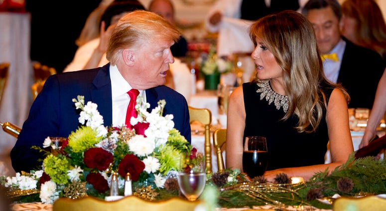 President Donald Trump and first lady Melania Trump talk at Mar-a-lago while there for Christmas Eve dinner in Palm Beach, Fla., Tuesday, Dec. 24, 2019. President Donald Trump and first lady Melania Trump talk at Mar-a-lago while there for Christmas Eve dinner in Palm Beach, Fla., Tuesday, Dec. 24, 2019.