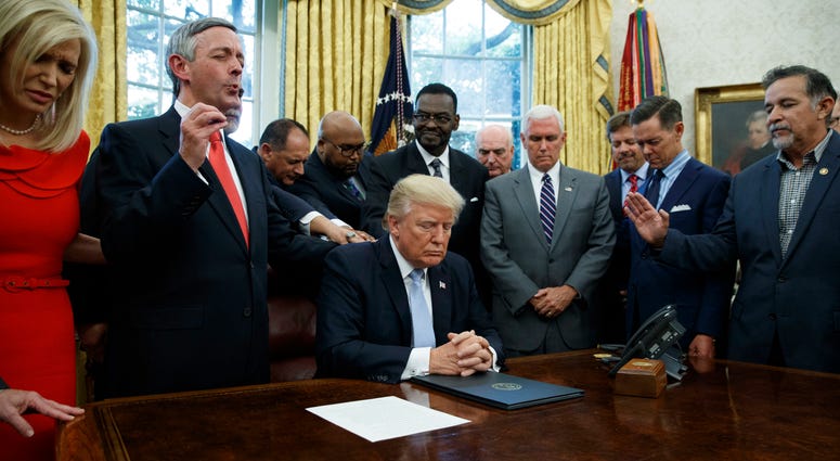 religious leaders pray with President Donald Trump after he signed a proclamation for a national day of prayer to occur on Sunday, Sept. 3, 2017, in the Oval Office of the White House in Washington. religious leaders pray with President Donald Trump after he signed a proclamation for a national day of prayer to occur on Sunday, Sept. 3, 2017, in the Oval Office of the White House in Washington.