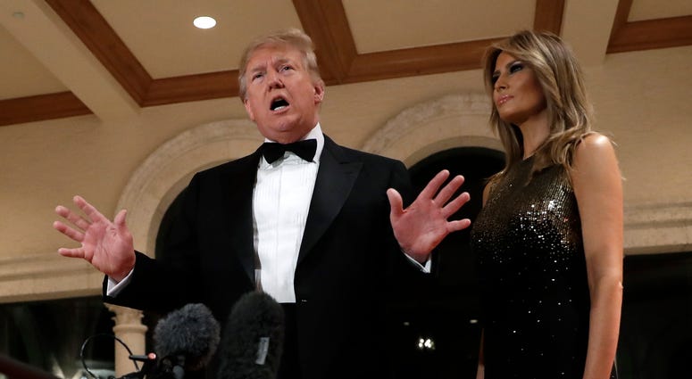 President Donald Trump speaks to the media about the situation at the U.S. embassy in Baghdad, from his Mar-a-Lago property, Tuesday, Dec. 31, 2019, in Palm Beach, Fla., as Melania Trump stands next to him. President Donald Trump speaks to the media about the situation at the U.S. embassy in Baghdad, from his Mar-a-Lago property, Tuesday, Dec. 31, 2019, in Palm Beach, Fla., as Melania Trump stands next to him.