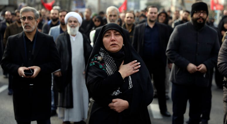 A woman mourns in a demonstration over the U.S. airstrike in Iraq that killed Iranian Revolutionary Guard Gen. Qassem Soleimani in Tehran, Iran, Jan. 3, 2020. A woman mournsIranian Revolutionary Guard Gen. Qassem Soleimani.