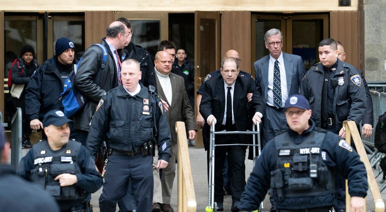 Harvey Weinstein, third from right, is surrounded by court officers as he leaves court following a pre trial hearing, Monday, Jan. 6, 2020, in New York. Harvey Weinstein