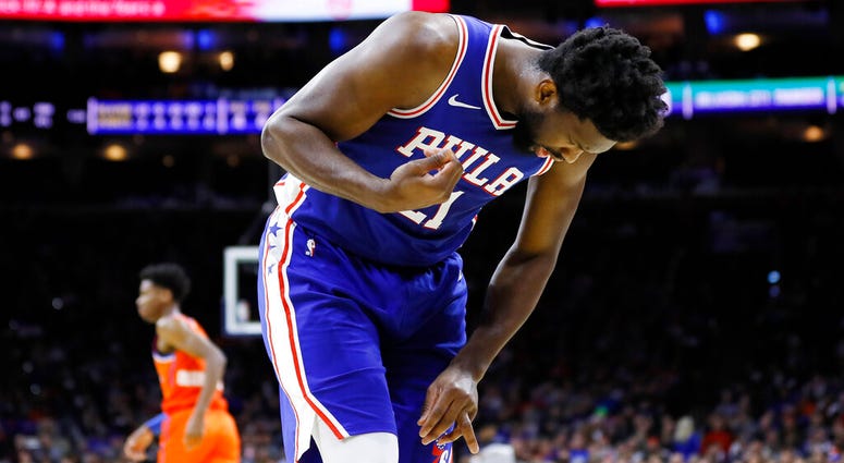 Philadelphia 76ers' Joel Embiid looks at his injured finger during the first half of an NBA basketball game against the Oklahoma City Thunder. Philadelphia 76ers' Joel Embiid looks at his injured finger during the first half of an NBA basketball game against the Oklahoma City Thunder.