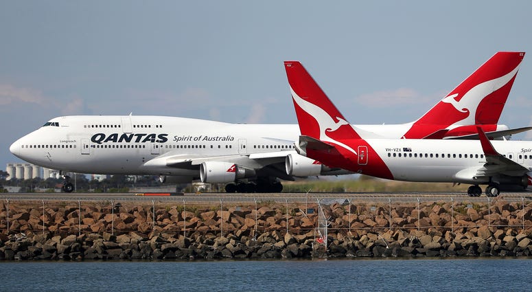Two Qantas planes taxi on the runway at Sydney Airport in Sydney, Australia, in 2015. Two Qantas planes taxi on the runway at Sydney Airport in Sydney, Australia, in 2015.