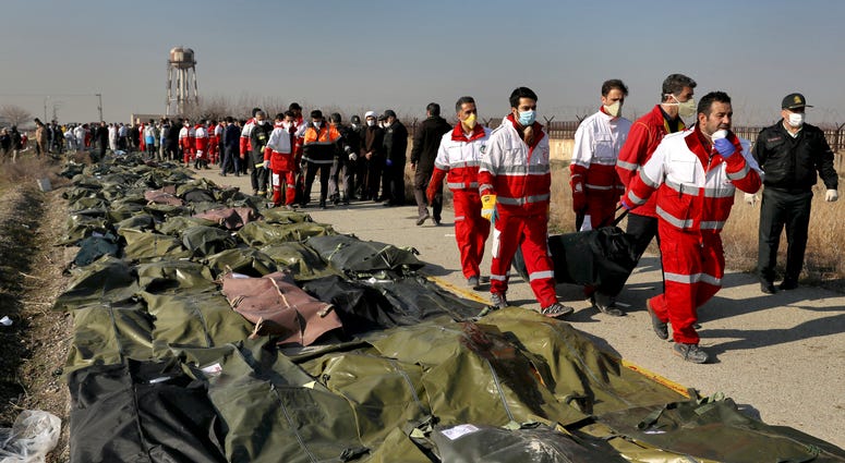 Rescue workers carry the body of a victim of a Ukrainian plane crash in Shahedshahr, southwest of Tehran, Iran.rescue workers carry the body of a victim of a Ukrainian plane crash in Shahedshahr, southwest of the capital Tehran, Iran, on Jan. 8. Rescue workers carry the body of a victim of a Ukrainian plane crash in Shahedshahr, southwest of Tehran, Iran.rescue workers carry the body of a victim of a Ukrainian plane crash in Shahedshahr, southwest of the capital Tehran, Iran, on Jan. 8.