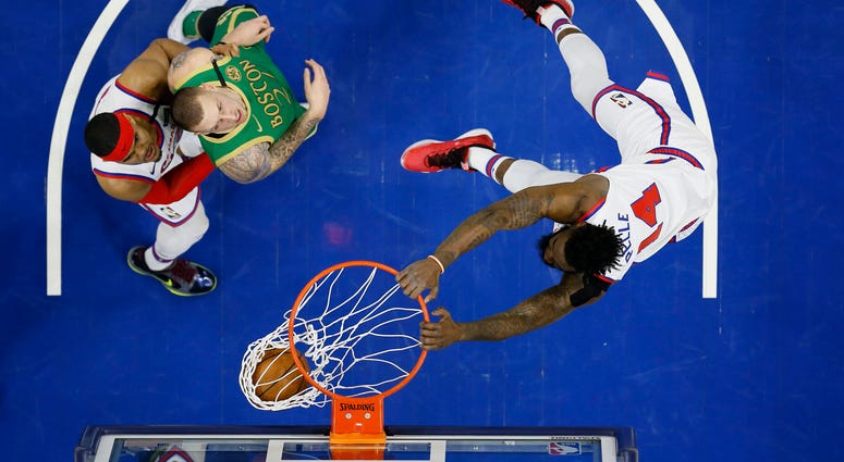 Philadelphia 76ers' Norvel Pelle, right, dunks the ball as Tobias Harris, left, and Boston Celtics' Daniel Theis look on during the second half of an NBA basketball game, Thursday, Jan. 9, 2020, in Philadelphia. Philadelphia 76ers' Norvel Pelle, right, dunks the ball as Tobias Harris, left, and Boston Celtics' Daniel Theis look on during the second half of an NBA basketball game, Thursday, Jan. 9, 2020, in Philadelphia.