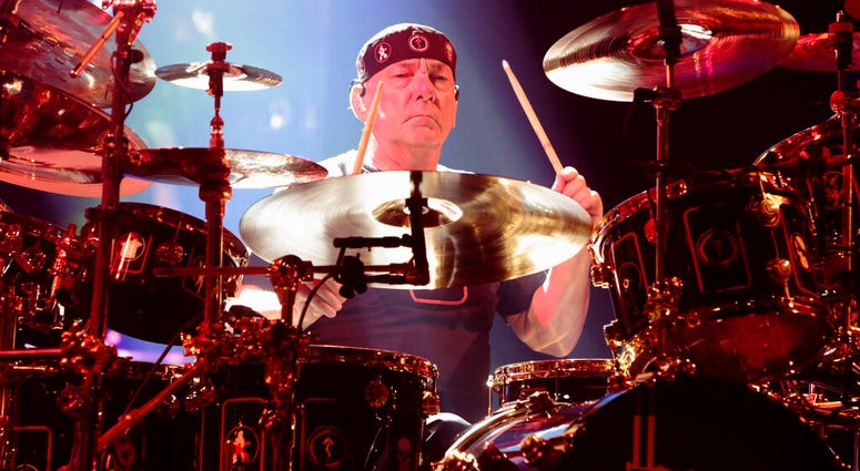 FILE - This June 25, 2015 file photo shows Neil Peart of the band Rush performing in concert during their R40 Live: 40th Anniversary Tour in Philadelphia. Neil Peart of the band Rush performing in concert during their R40 Live: 40th Anniversary Tour in Philadelphia.