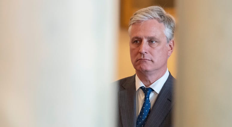 In this Jan. 8, 2020, photo, national security adviser Robert O'Brien, listens as President Donald Trump addresses the nation from the White House on the ballistic missile strike that Iran launched against Iraqi air bases housing troops in Washington. Robert O'Brien