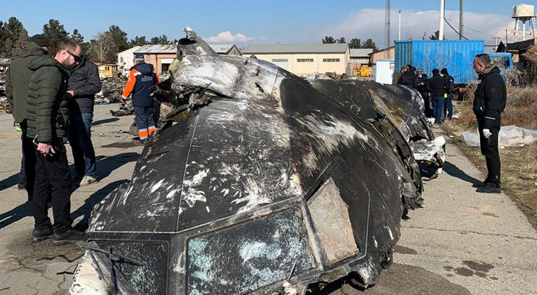 This undated photo provided by the Ukrainian Presidential Press Office, shows the wreckage of the Ukraine International Airlines Boeing 737-800 at the scene of the crash in Shahedshahr, southwest of the capital Tehran, Iran. Wreckage of Ukraine International Airlines Boeing 737-800