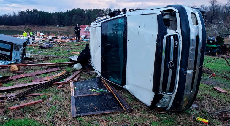 The Bossier Parish Sheriff's Office said that the bodies of an elderly couple were found Saturday near their demolished trailer by firefighters. A search for more possible victims was underway. Photo provided by Bossier Parish Sheriff's Office that shows damage from Friday nights severe weather, including the home of an elderly in Bossier Parish, La., on Saturday.