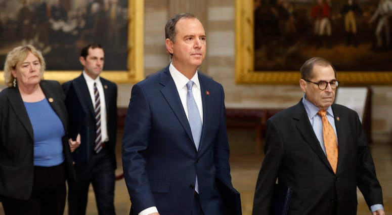 Impeachment managers, House Judiciary Committee Chairman, Rep. Jerrold Nadler, right, and House Intelligence Committee Chairman Adam Schiff, center, lead as Rep. Zoe Lofgren and Rep. Jason Crow follow on their way to the Senate on Capitol Hill, Thursday. Impeachment managers, House Judiciary Committee Chairman, Rep. Jerrold Nadler, right, and House Intelligence Committee Chairman Adam Schiff, center, lead as Rep. Zoe Lofgren and Rep. Jason Crow follow on their way to the Senate on Capitol Hill, Thursday.