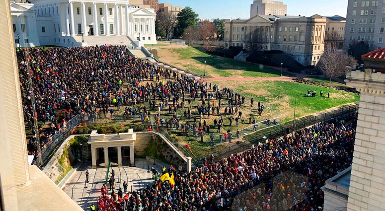 Demonstrators are seen during a pro-gun rally, Monday, Jan. 20, 2020, in Richmond, Va. Demonstrators are seen during a pro-gun rally, Monday, Jan. 20, 2020, in Richmond, Va.