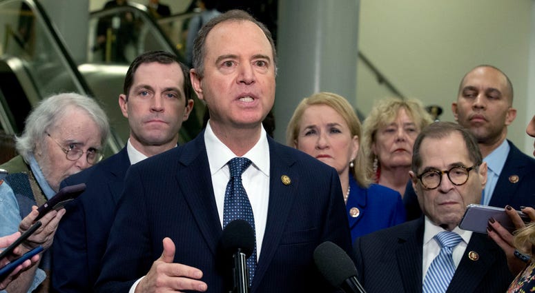 House Intelligence Committee Chairman Adam Schiff, D-Calif., accompanied by the impeachment managers, speaks to reporters, on Capitol Hill in Washington, Wednesday, Jan. 22, 2020. House Intelligence Committee Chairman Adam Schiff, D-Calif., accompanied by the impeachment managers, speaks to reporters, on Capitol Hill in Washington, Wednesday, Jan. 22, 2020.