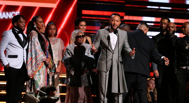 John Legend, center, DJ Khaled and members of Nipsey Hussle's family accept the award for best rap/sung performance at the 62nd annual Grammy Awards on Sunday, Jan. 26, 2020, in Los Angeles. John Legend, center, DJ Khaled and members of Nipsey Hussle's family accept the award for best rap/sung performance at the 62nd annual Grammy Awards on Sunday, Jan. 26, 2020, in Los Angeles.