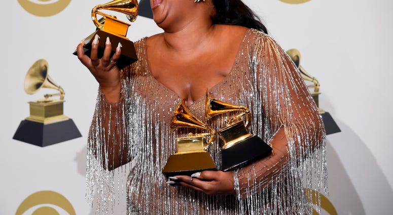 Lizzo poses in the press room with the awards for best pop solo performance, best urban contemporary album and best traditional R&B performance at the 62nd annual Grammy Awards at the Staples Center on Sunday, Jan. 26, 2020, in Los Angeles. Lizzo poses in the press room with the awards for best pop solo performance, best urban contemporary album and best traditional R&B performance at the 62nd annual Grammy Awards at the Staples Center on Sunday, Jan. 26, 2020, in Los Angeles.