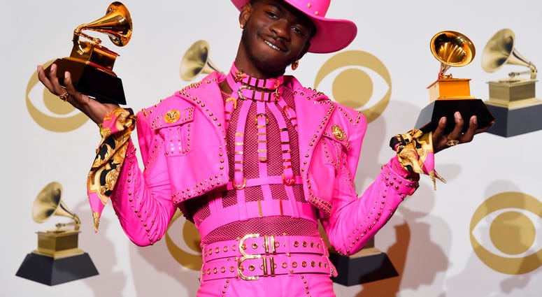 Lil Nas X poses in the press room with the awards for best music video and best pop duo/group performance at the 62nd annual Grammy Awards at the Staples Center on Sunday, Jan. 26, 2020, in Los Angeles. Lil Nas X poses in the press room with the awards for best music video and best pop duo/group performance at the 62nd annual Grammy Awards at the Staples Center on Sunday, Jan. 26, 2020, in Los Angeles.