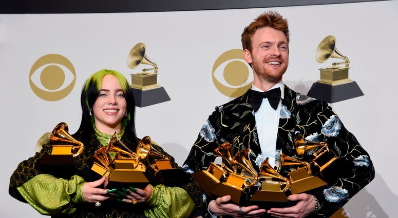 From left: Billie Eilish and Finneas O'Connell pose in the press room with the awards for best album, best engineered album, best pop vocal album, best song, best record, best new artist and best producer, non-classical, at the 62nd annual Grammy Awards. From left: Billie Eilish and Finneas O'Connell pose in the press room with the awards for best album, best engineered album, best pop vocal album, best song, best record, best new artist and best producer, non-classical, at the 62nd annual Grammy Awards.