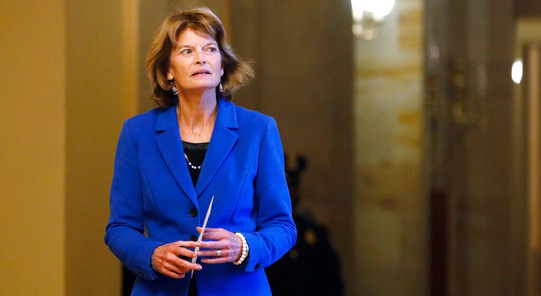 Sen. Lisa Murkowski, R-Alaska, returns to the Senate chamber after a meeting in the Majority Leaders office during a break in the impeachment trial of President Donald Trump at the U.S. Capitol Friday Jan 31, 2020, in Washington. Sen. Lisa Murkowski, R-Alaska, returns to the Senate chamber after a meeting in the Majority Leaders office during a break in the impeachment trial of President Donald Trump at the U.S. Capitol Friday Jan 31, 2020, in Washington.