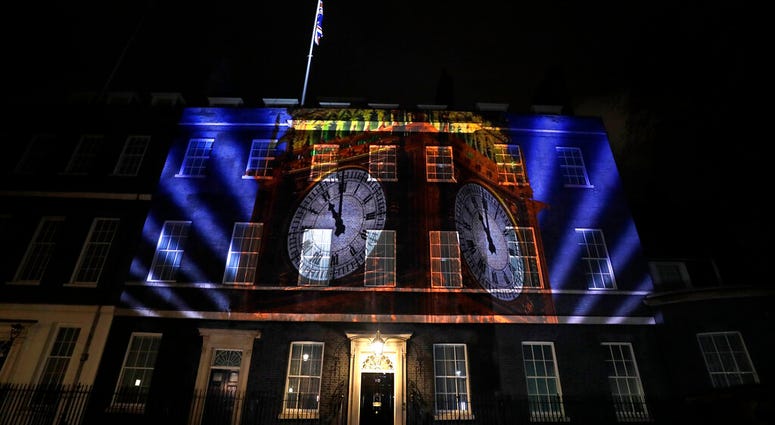 An image of the clock face of 'Big Ben' is projected onto the exterior of 10 Downing street, the residence of the British Prime Minister, in London as Britain left the European Union, Friday, Jan. 31, 2020. An image of the clock face of 'Big Ben' is projected onto the exterior of 10 Downing street, the residence of the British Prime Minister, in London as Britain left the European Union, Friday, Jan. 31, 2020.