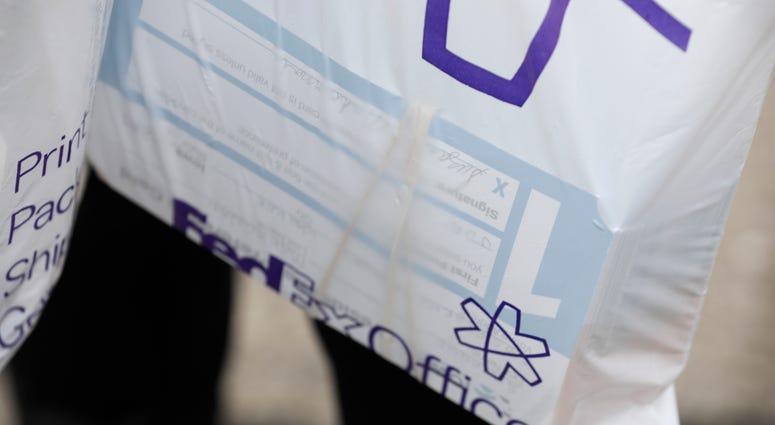 Julie Stewart, precinct captain in Waukee, Iowa, carries a bag of precinct preference cards back to her car after trying to drop them off at the Iowa Democratic Party headquarters, Tuesday, Feb. 4, 2020, in Des Moines, Iowa. Julie Stewart, precinct captain in Waukee, Iowa, carries a bag of precinct preference cards back to her car after trying to drop them off at the Iowa Democratic Party headquarters, Tuesday, Feb. 4, 2020, in Des Moines, Iowa.