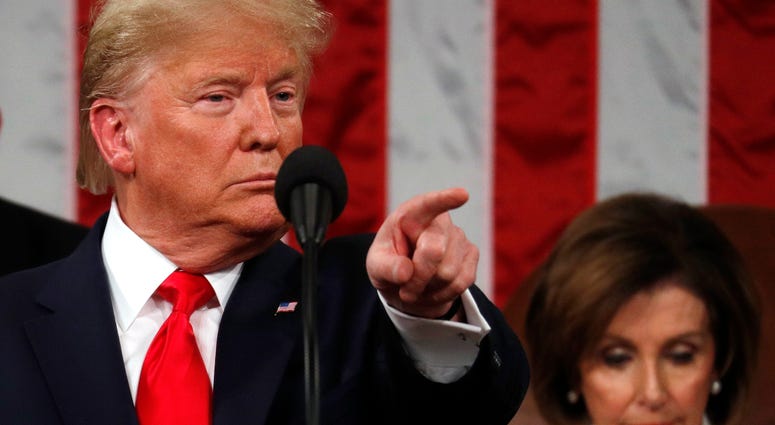 President Donald Trump delivers his State of the Union address to a joint session of Congress in the House Chamber on Capitol Hill in Washington, Tuesday, Feb. 4, 2020, as Nancy Pelosi listens. President Donald Trump delivers his State of the Union address to a joint session of Congress in the House Chamber on Capitol Hill in Washington, Tuesday, Feb. 4, 2020, as Nancy Pelosi listens.