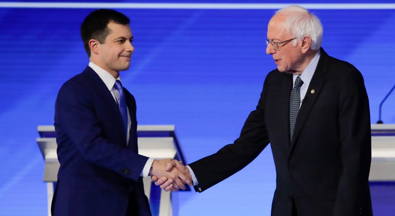 Democratic presidential candidates former South Bend Mayor Pete Buttigieg and Sen. Bernie Sanders shake hands on stage Friday, before the start of a Democratic presidential primary debate in Manchester, N.H. Democratic presidential candidates former South Bend Mayor Pete Buttigieg and Sen. Bernie Sanders shake hands on stage Friday, before the start of a Democratic presidential primary debate in Manchester, N.H.