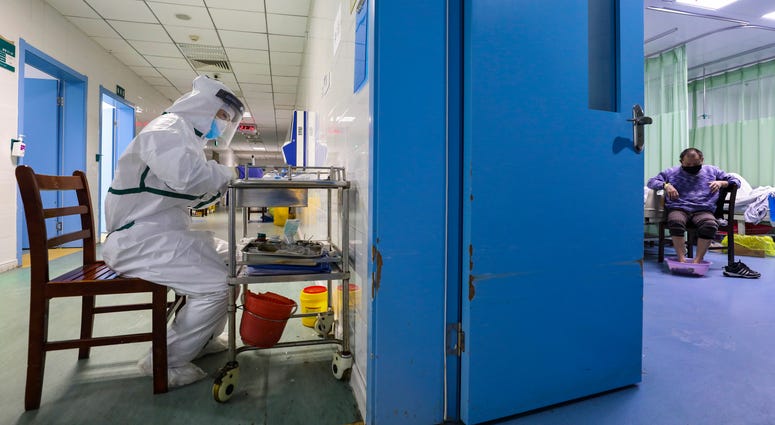 The number of confirmed cases of the new virus has risen again in China on Saturday. A nurse takes notes in the isolation ward for 2019-nCoV patients at a hospital in Wuhan in central China's Hubei province, on Thursday.